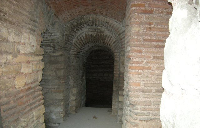 An arched passage in brick masonry