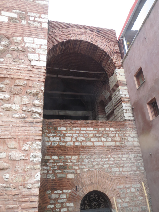 Brick arches beside later construction