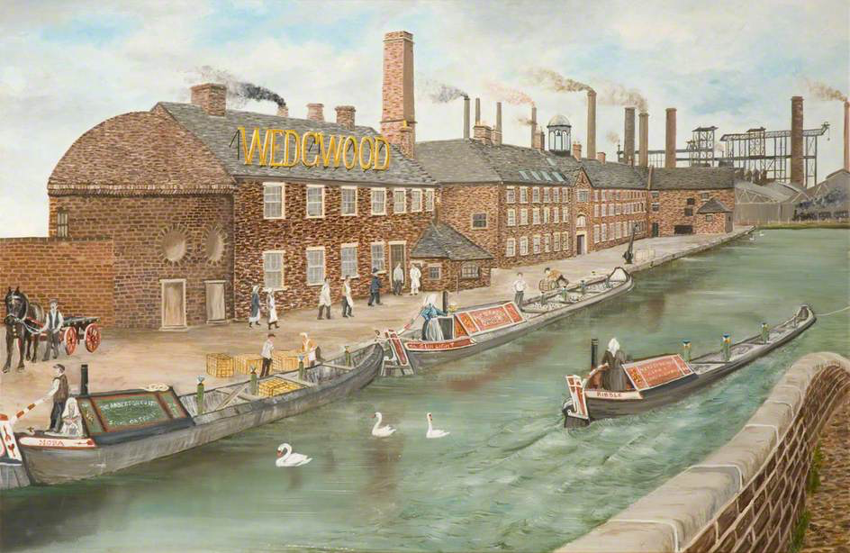A factory beside a canal: buildings, workers, boats and chimneys