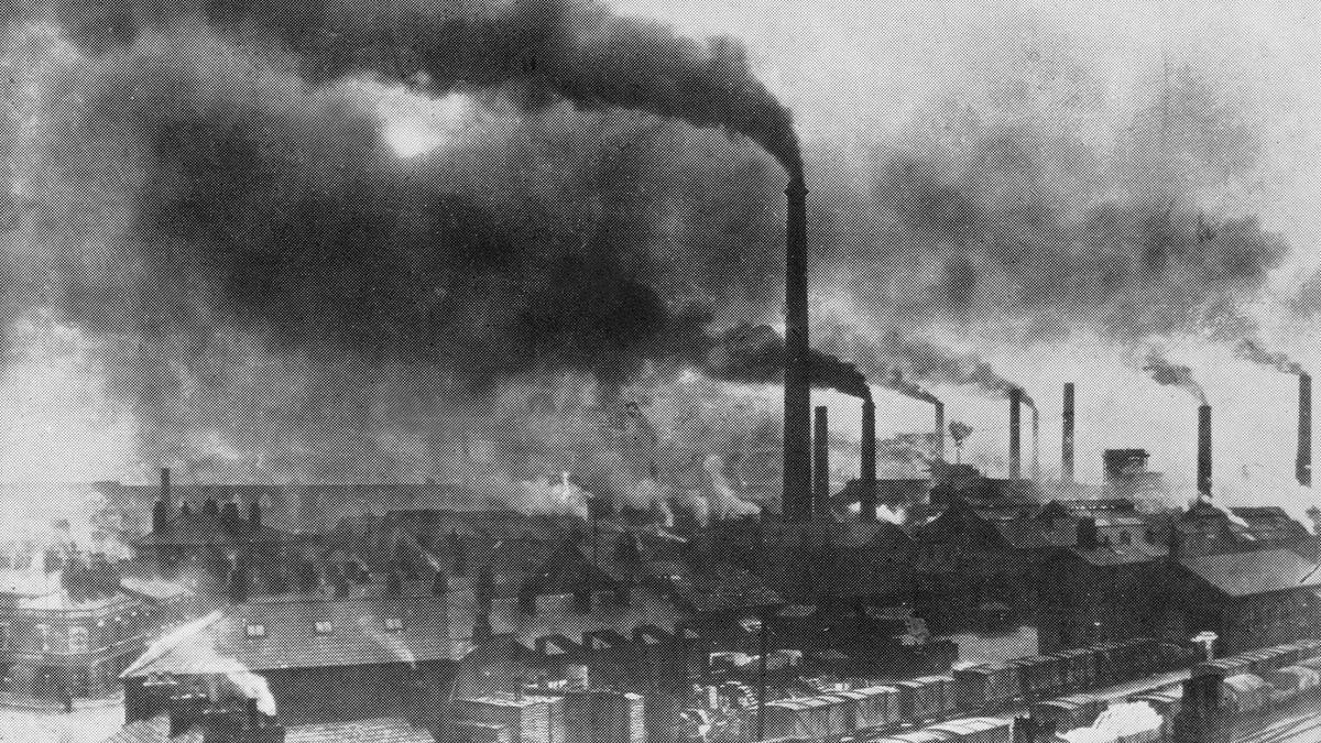 Industrial chimneys and dense smoke